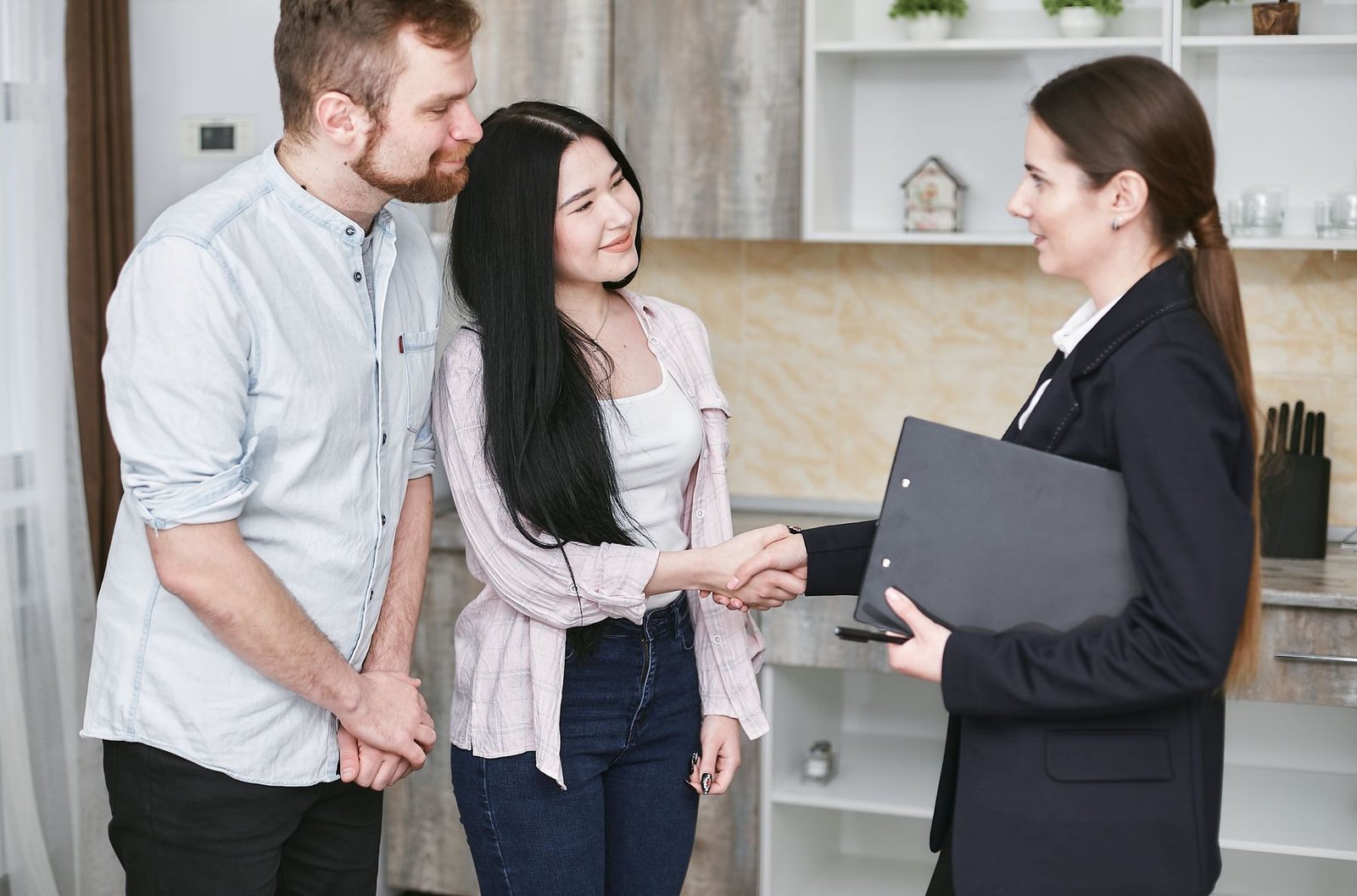 A homeowner reviewing refinance paperwork with their loan officer